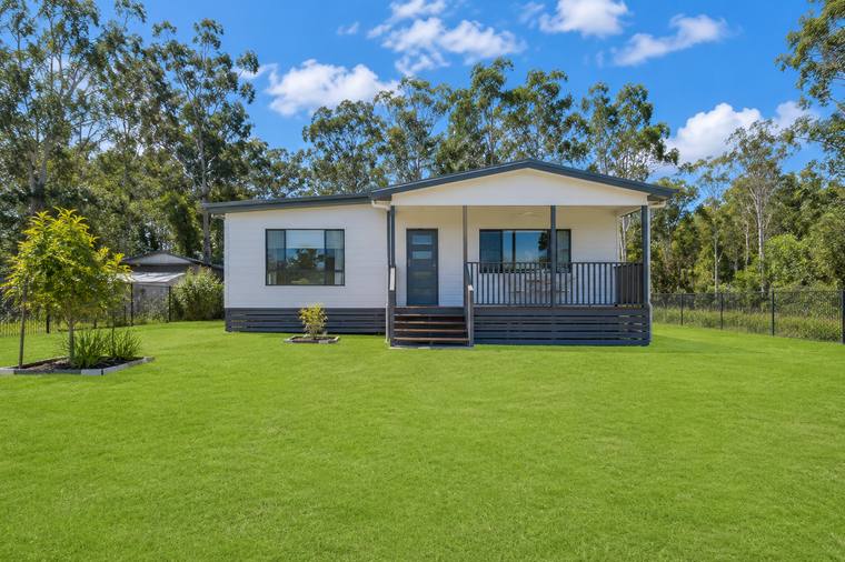 White weatherboard Australian home with a wide front verandah
