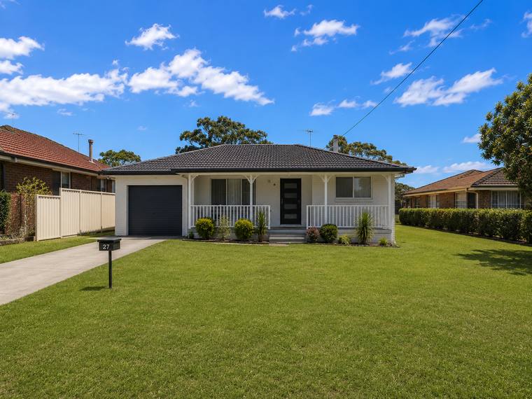 Single-storey brick and render home with landscaped path